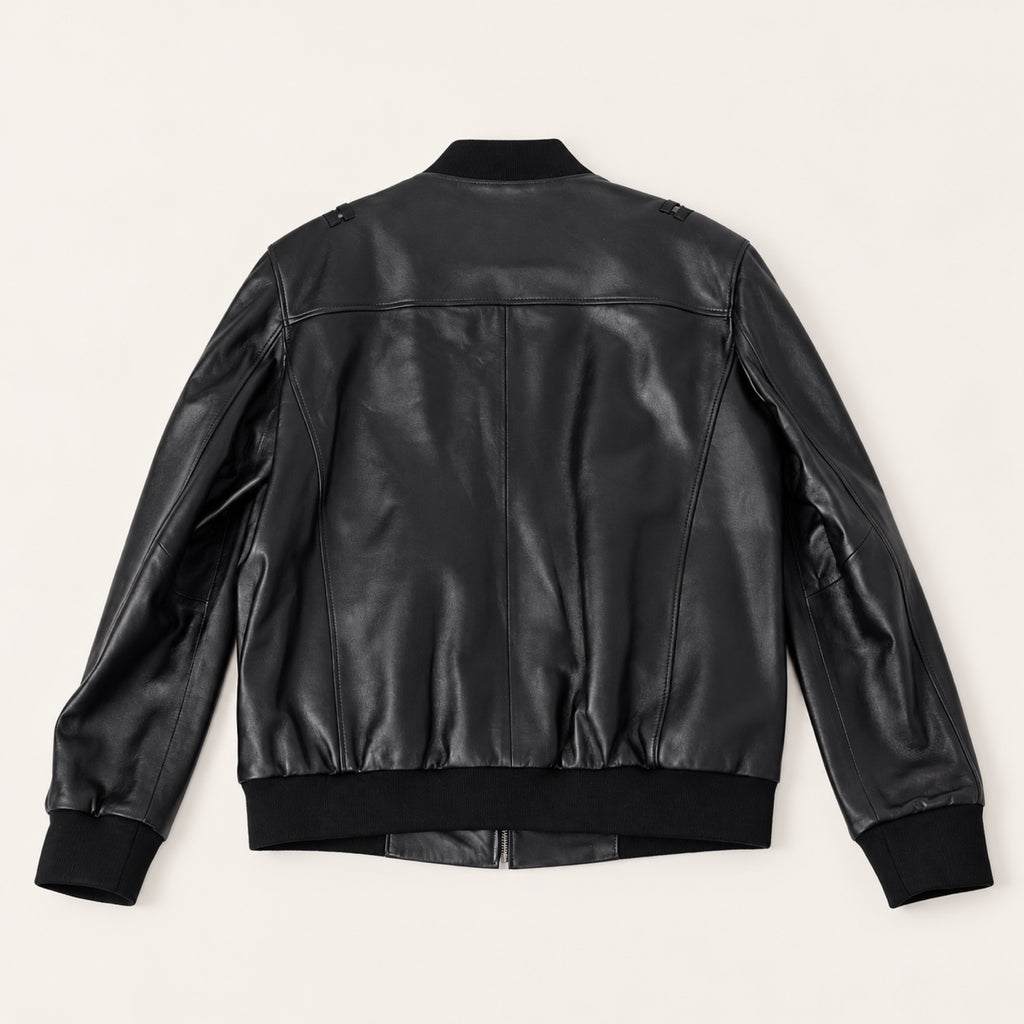 Black Bomber Jacket, rear view on an ivory studio background.