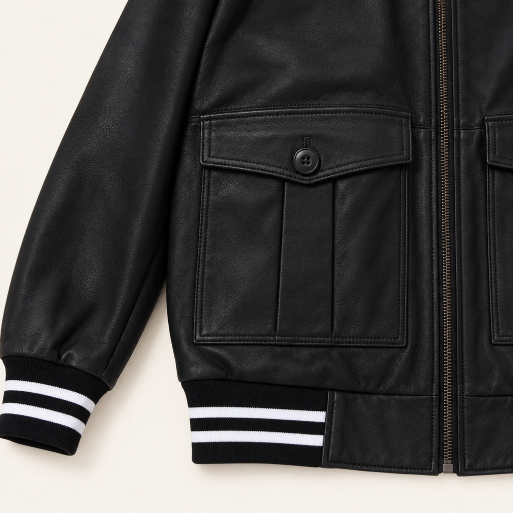 Black Striped Trim Bomber Jacket, close-up detail on an ivory studio background.