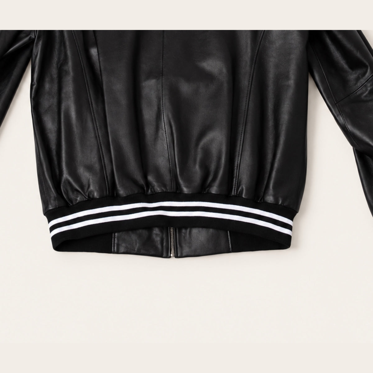 Black Striped Trim Bomber Jacket, ribbed hem and rear seam detail on an ivory studio background.