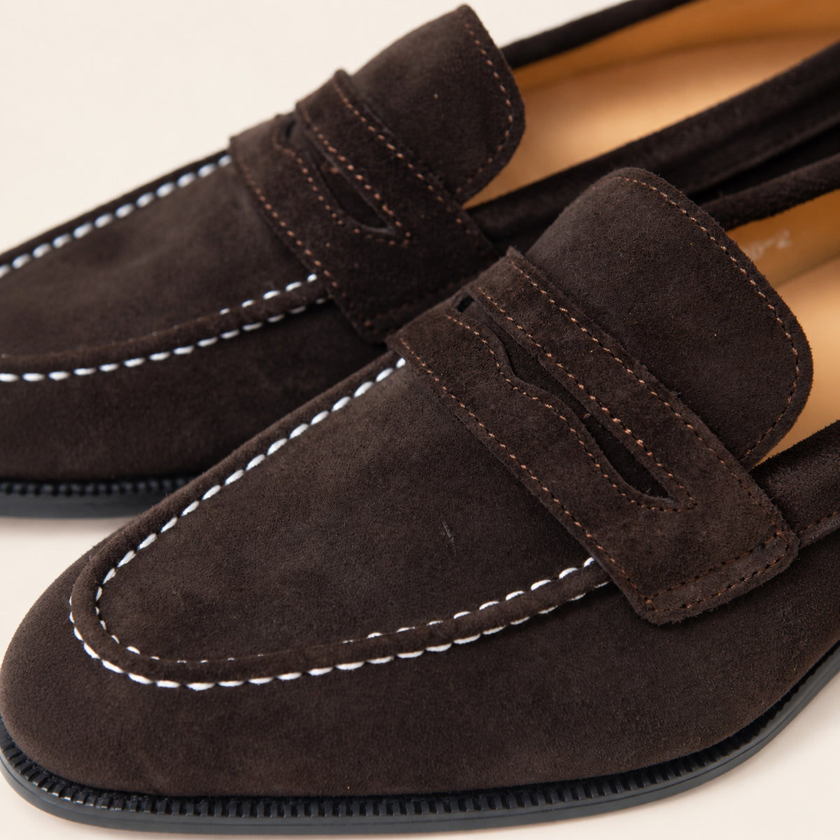 Expresso Brown Suede, close-up detail on an ivory studio background.