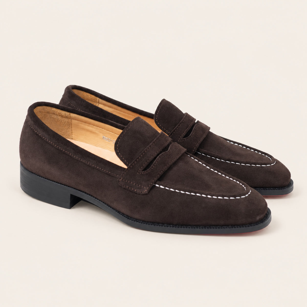 Expresso Brown Suede, three-quarter front view on an ivory studio background.