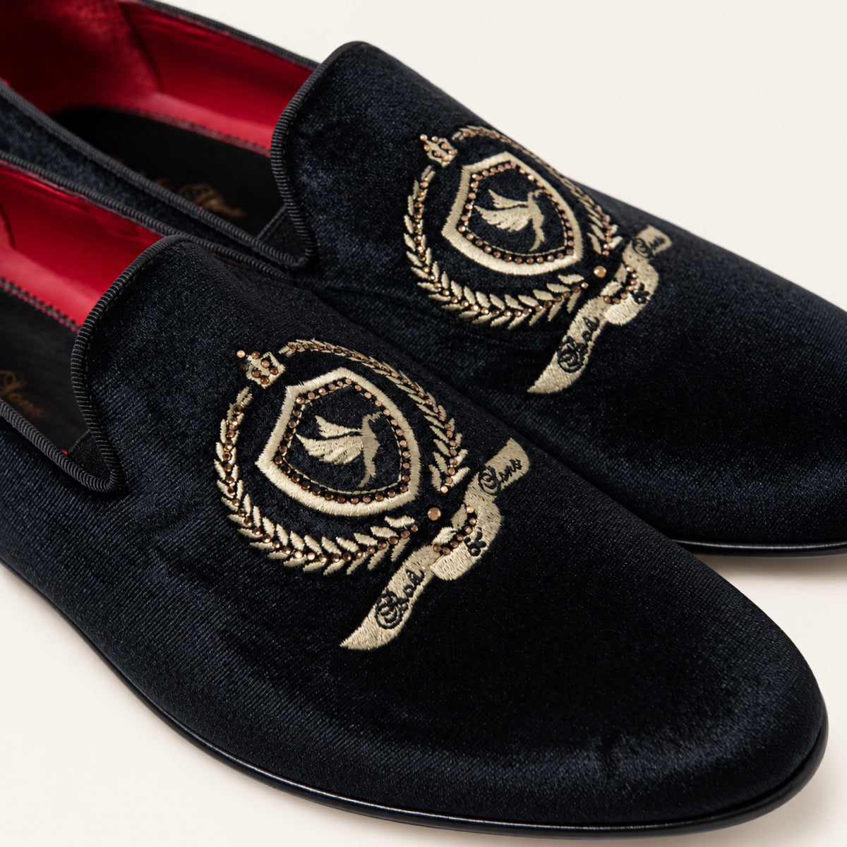 The Sultan Embroidered Loafer — Black, close-up detail on an ivory studio background.