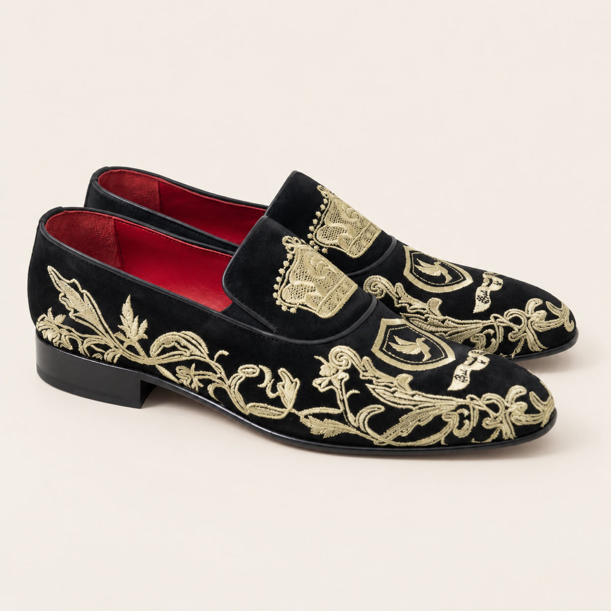The Sultan Embroidered Loafer — Black & Gold, three-quarter front view on an ivory studio background.