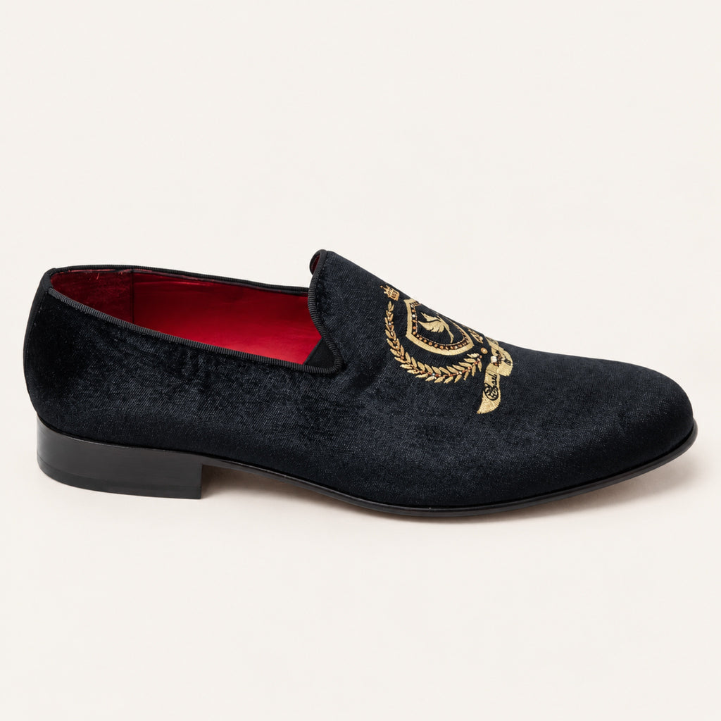 The Sultan Embroidered Loafer — Black, side profile on an ivory studio background.