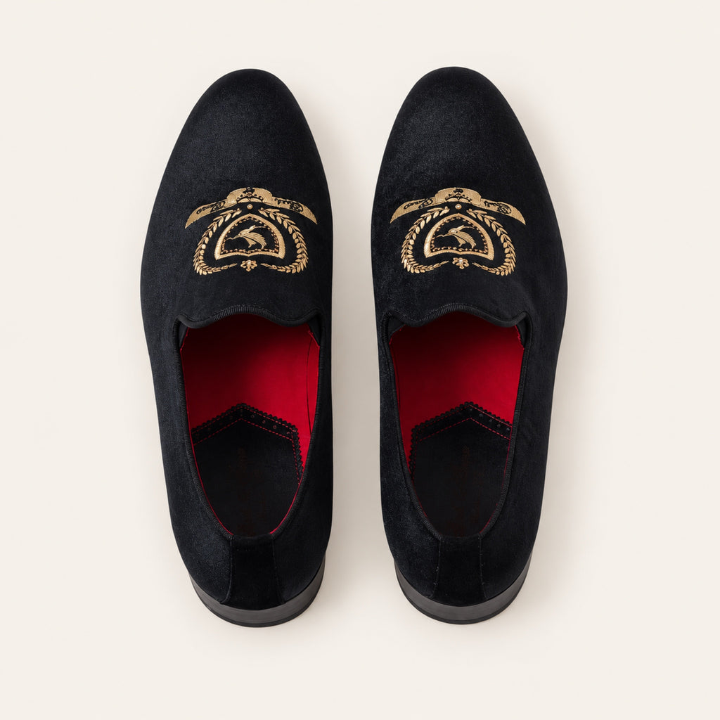 The Sultan Embroidered Loafer — Black, top view on an ivory studio background.