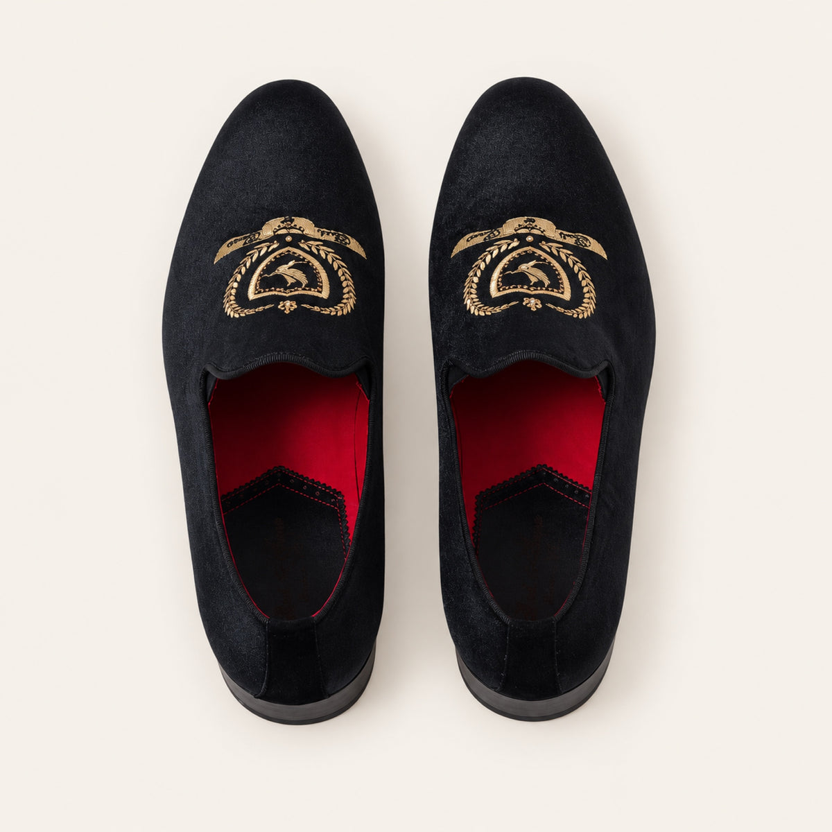 The Sultan Embroidered Loafer — Black, top view on an ivory studio background.